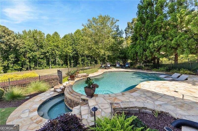 view of swimming pool with a patio