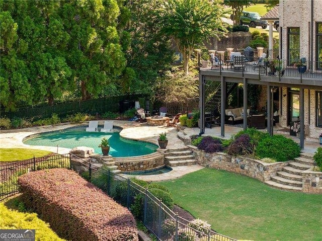 view of swimming pool with a yard and a patio