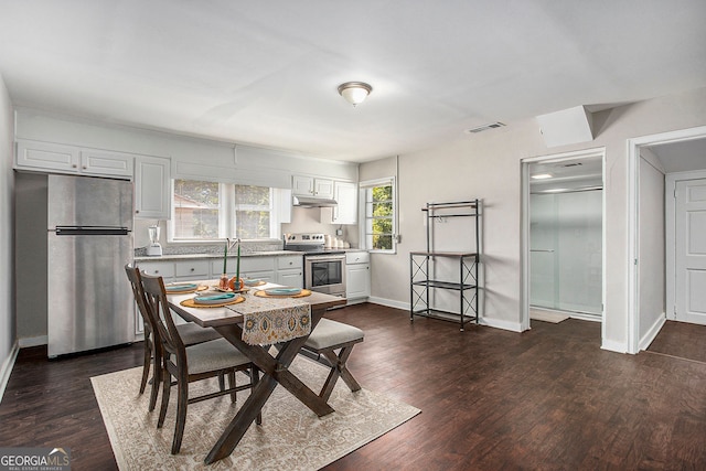 dining room featuring dark wood-type flooring