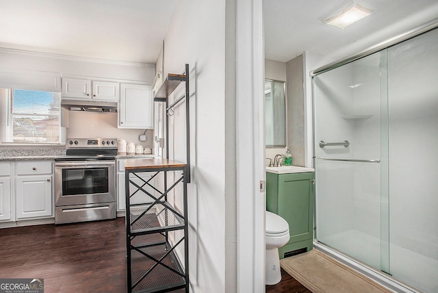 kitchen with stainless steel range with electric stovetop, sink, dark wood-type flooring, and white cabinets