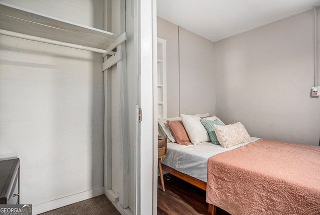 bedroom featuring dark wood-type flooring