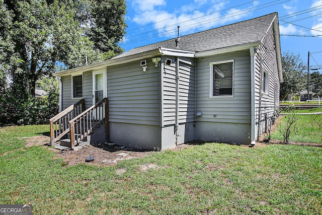 view of side of property featuring a yard