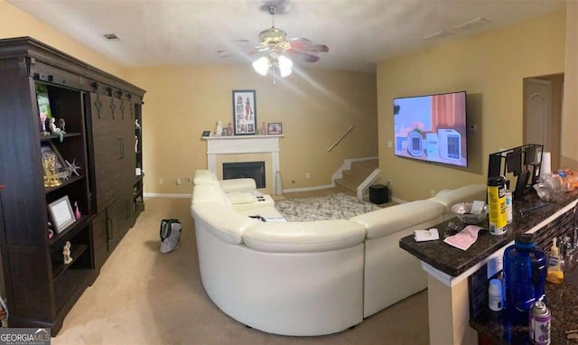 living room with carpet flooring and ceiling fan