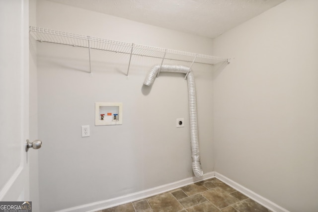 laundry room featuring hookup for a washing machine, hookup for an electric dryer, laundry area, baseboards, and stone finish floor