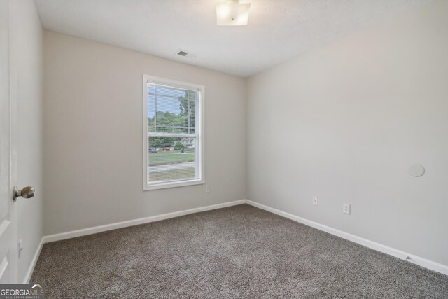 empty room with carpet flooring