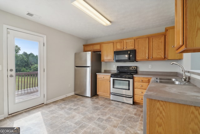 kitchen featuring stainless steel appliances and sink