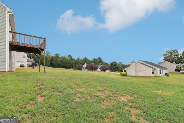 view of yard with a wooden deck