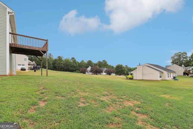 view of yard featuring a deck and a carport