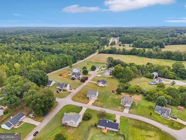 aerial view featuring a view of trees