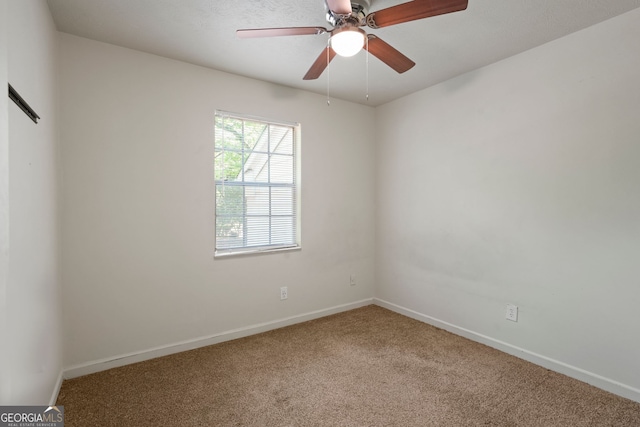 6584 Sleepy Hollow Ln, Morrow, GA 30260 - carpeted empty room featuring baseboards and a ceiling fan