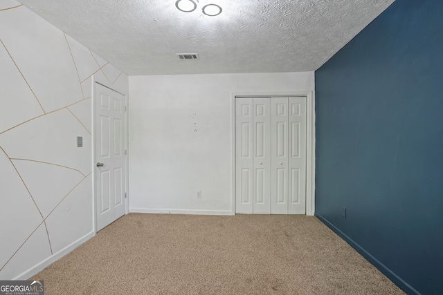 6584 Sleepy Hollow Ln, Morrow, GA 30260 - spare room featuring a textured ceiling, wood finished floors, and baseboards