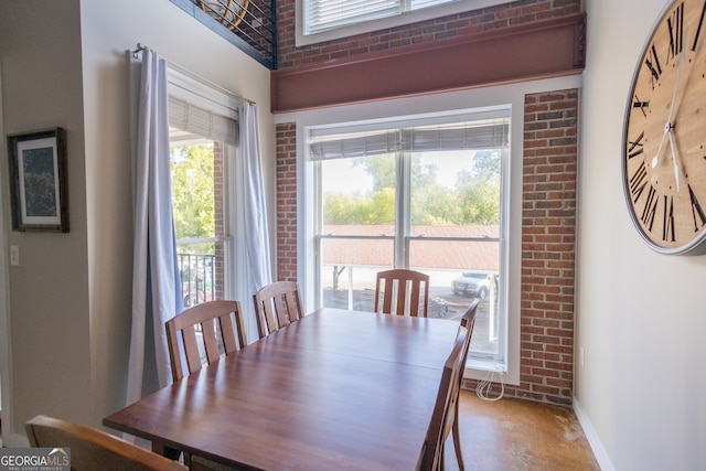 dining area with brick wall