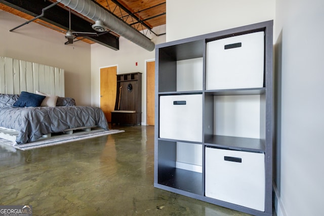 unfurnished bedroom featuring concrete flooring