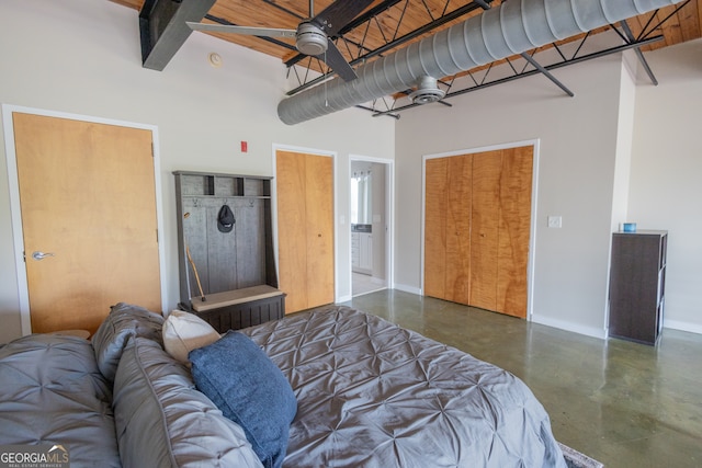 bedroom with concrete floors and ceiling fan