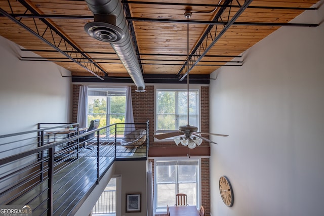 interior space featuring wood ceiling and ceiling fan