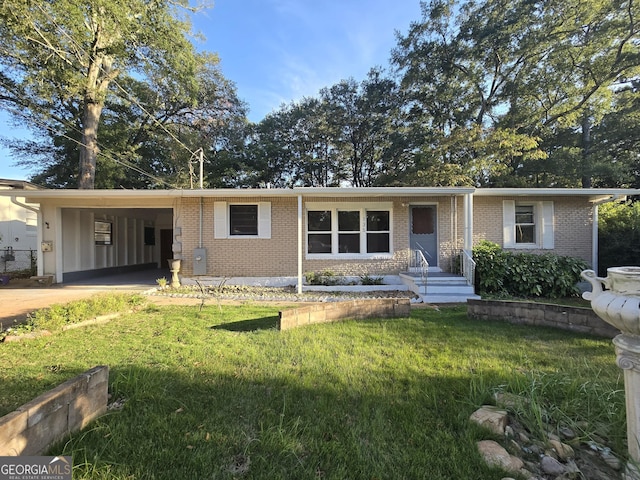 ranch-style house featuring a front yard and a carport