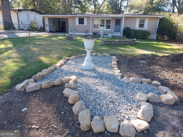 ranch-style home featuring a front yard