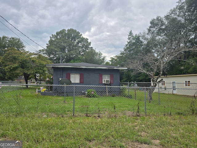 view of front facade with cooling unit and a front lawn