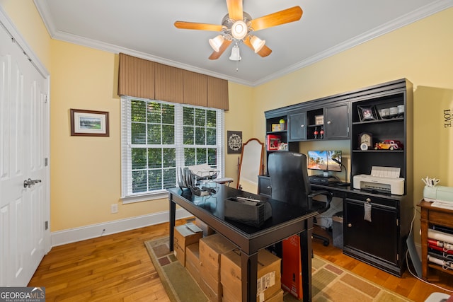 office with ornamental molding, wood-type flooring, and ceiling fan