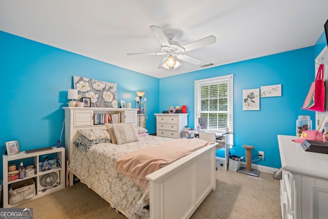 bedroom with ceiling fan and light colored carpet