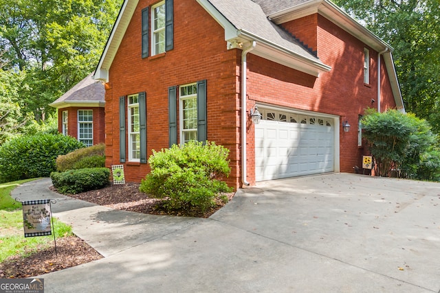 view of side of home with a garage