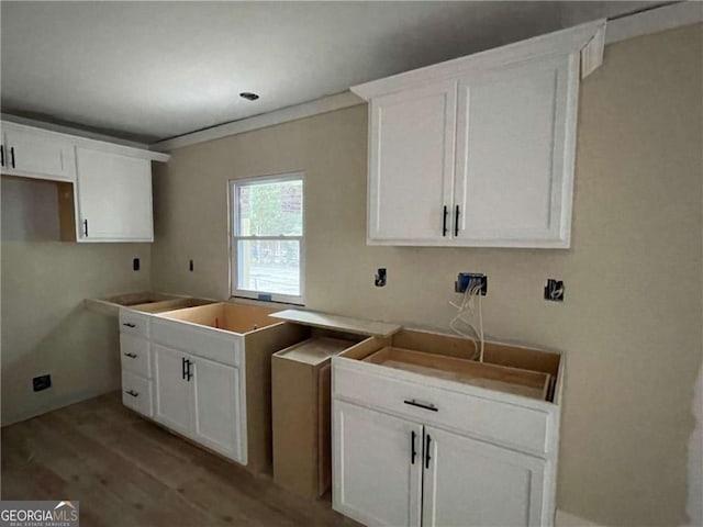 kitchen featuring white cabinets and light hardwood / wood-style floors