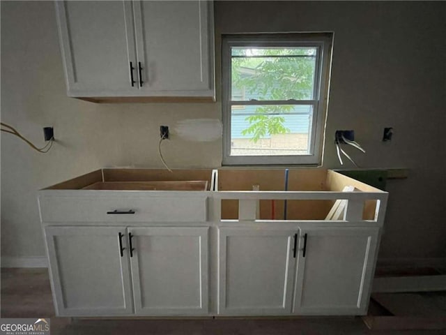 kitchen featuring white cabinetry