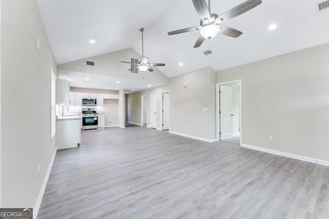 unfurnished living room with high vaulted ceiling, sink, ceiling fan, and light hardwood / wood-style floors