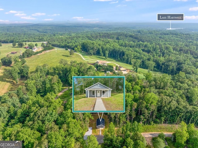 birds eye view of property featuring a rural view