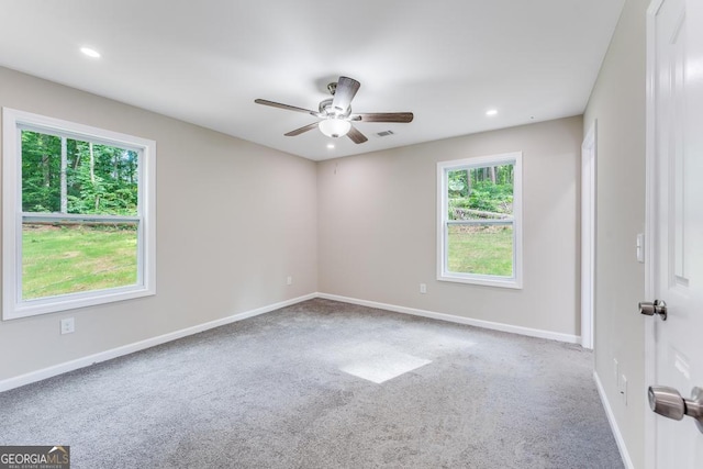 carpeted empty room with ceiling fan