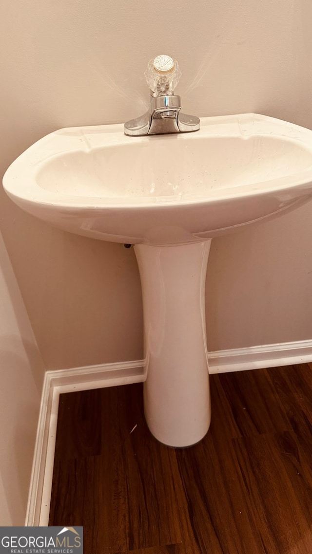 room details featuring sink and wood-type flooring