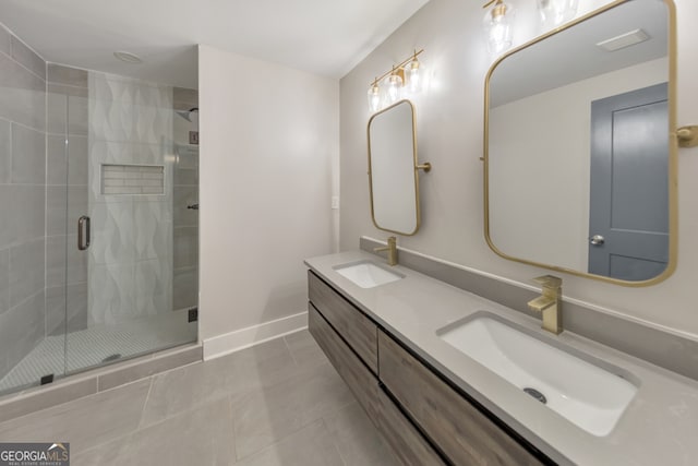 bathroom featuring tile patterned floors, an enclosed shower, and vanity