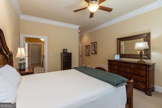 carpeted bedroom with crown molding, a ceiling fan, and baseboards