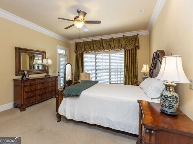 bedroom with ceiling fan, light colored carpet, and crown molding