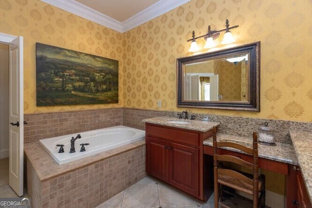 bathroom with crown molding, vanity, tile patterned floors, and tiled bath