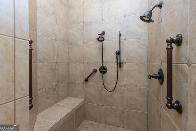 full bathroom with a tile shower