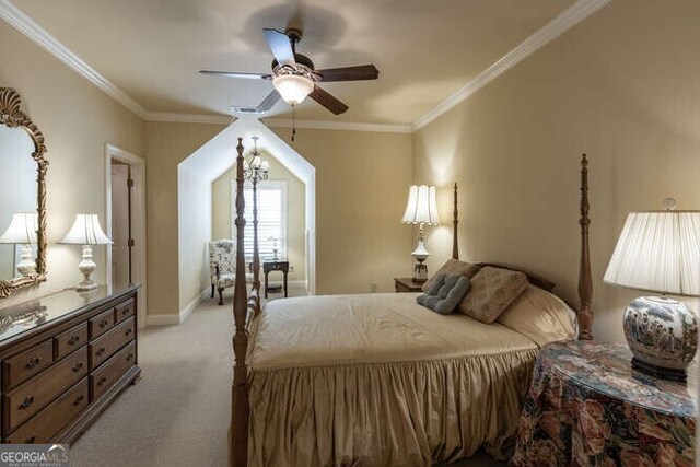 bedroom with crown molding, ceiling fan, and carpet floors