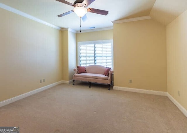 living area with ceiling fan, crown molding, light carpet, and vaulted ceiling