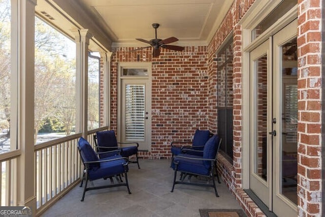 sunroom / solarium with ceiling fan