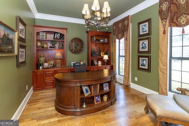 office area featuring ornamental molding, light hardwood / wood-style flooring, and an inviting chandelier