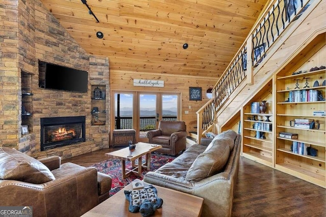 living room featuring hardwood / wood-style floors, high vaulted ceiling, and wooden ceiling