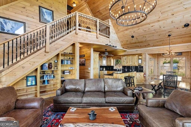 living room with wood walls, wooden ceiling, wood-type flooring, high vaulted ceiling, and a chandelier