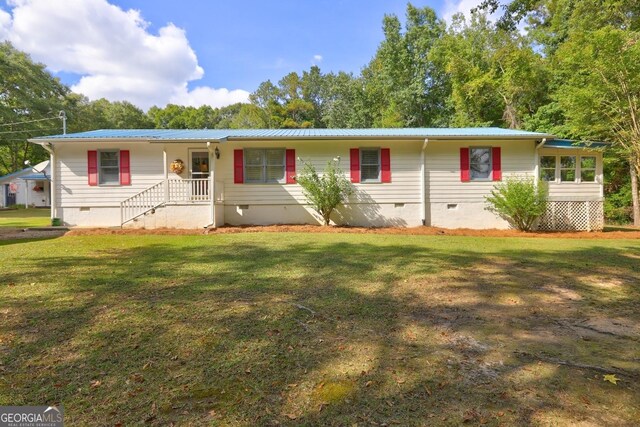 ranch-style house with a front lawn and a porch