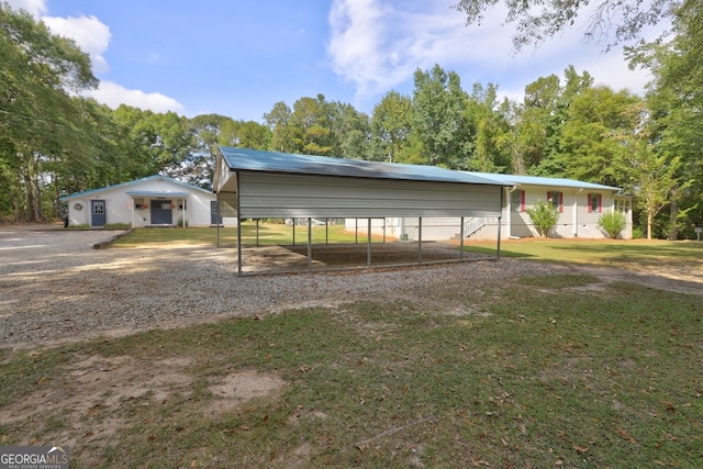 single story home featuring a carport and a front yard