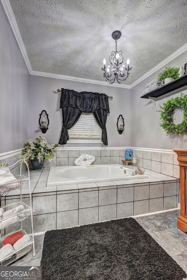 interior space with ornamental molding, a textured ceiling, a relaxing tiled tub, and a chandelier