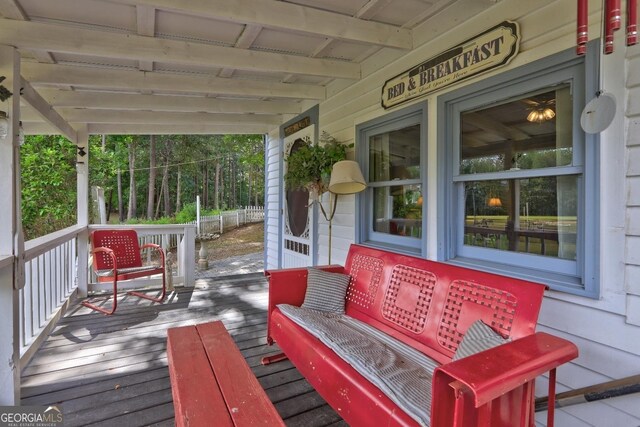 wooden terrace featuring a porch