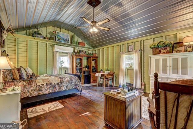 bedroom with vaulted ceiling, dark hardwood / wood-style flooring, ceiling fan, and wood ceiling