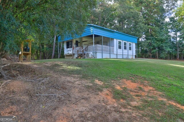 view of front of home with covered porch and a front yard