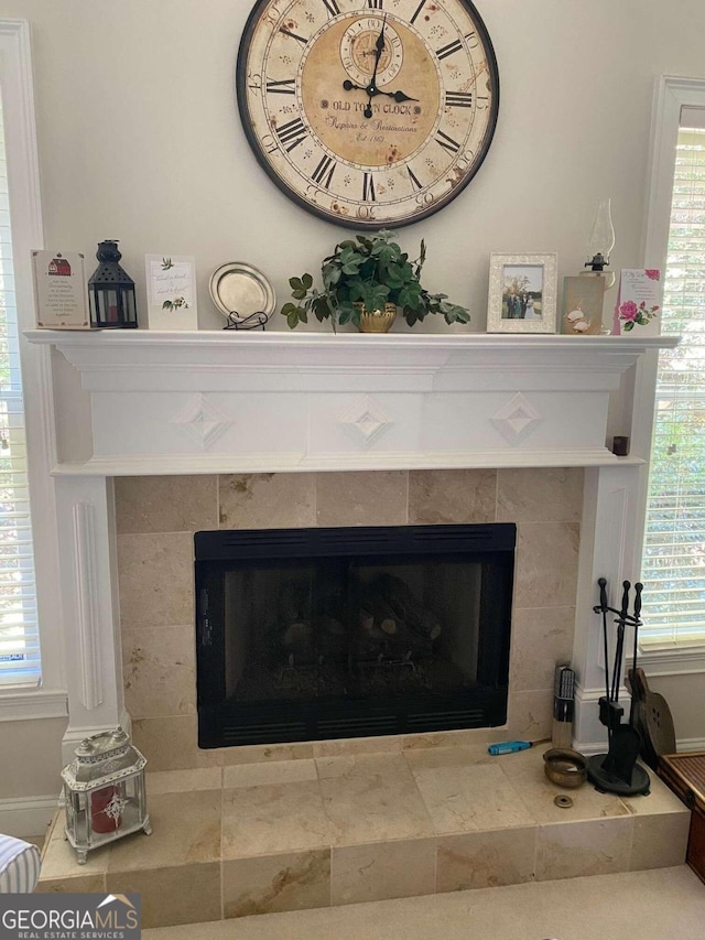 2631 Gladstone Ter, Woodstock, GA 30189 - interior details featuring a tile fireplace and baseboards