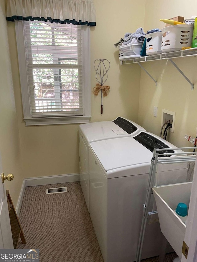 2631 Gladstone Ter, Woodstock, GA 30189 - laundry area featuring carpet flooring, laundry area, washer and clothes dryer, visible vents, and baseboards